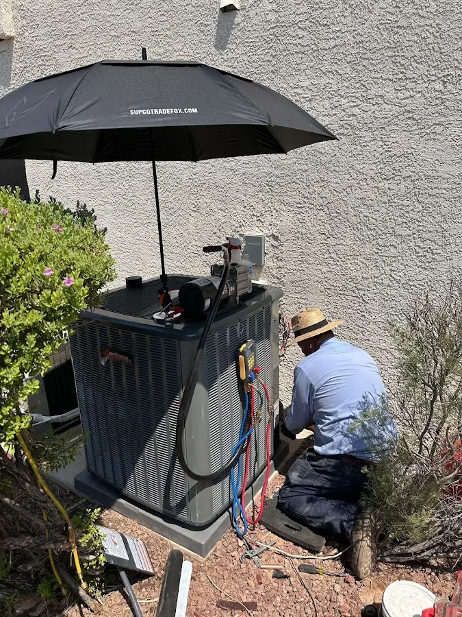 HVAC technician performing outdoor AC maintenance in Temple Hills