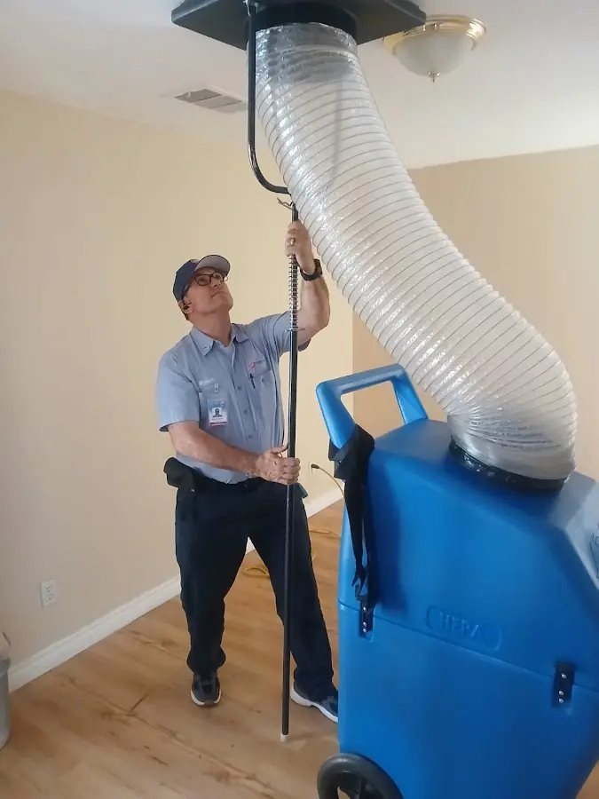 Furnace Tune-Up technician using HEPA equipment in Temple Hills